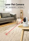 C19 laser pet camera on a side table playing a laser dot for a cat in a living room